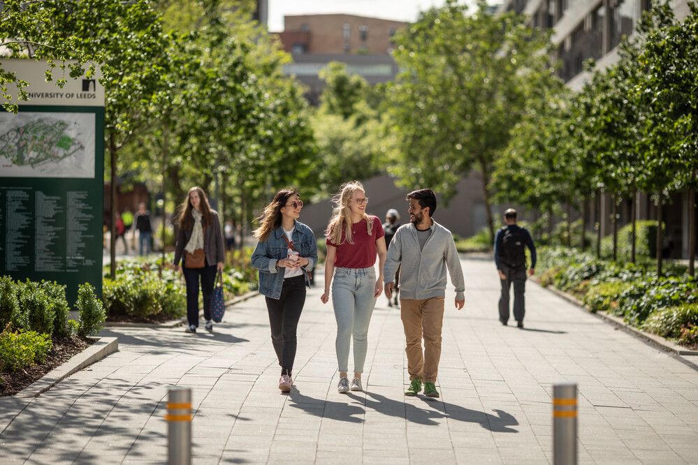 Students walking through the University of Leeds campus